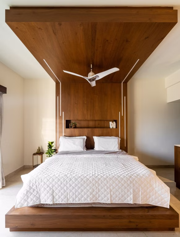 Bedroom interior with wooden false ceiling Tamil Nadu home